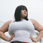 photo of woman wearing white tank top