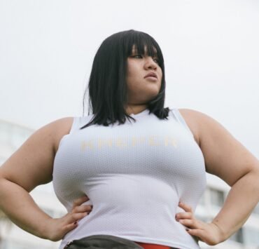 photo of woman wearing white tank top