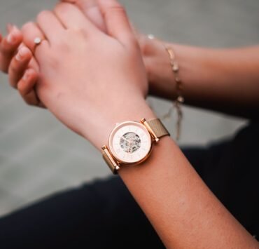 Woman’s hands wearing a rose-gold mechanical watch