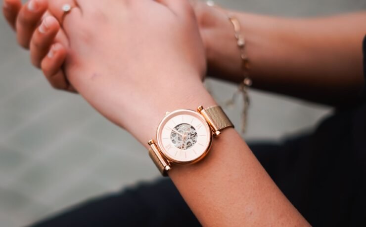 Woman’s hands wearing a rose-gold mechanical watch